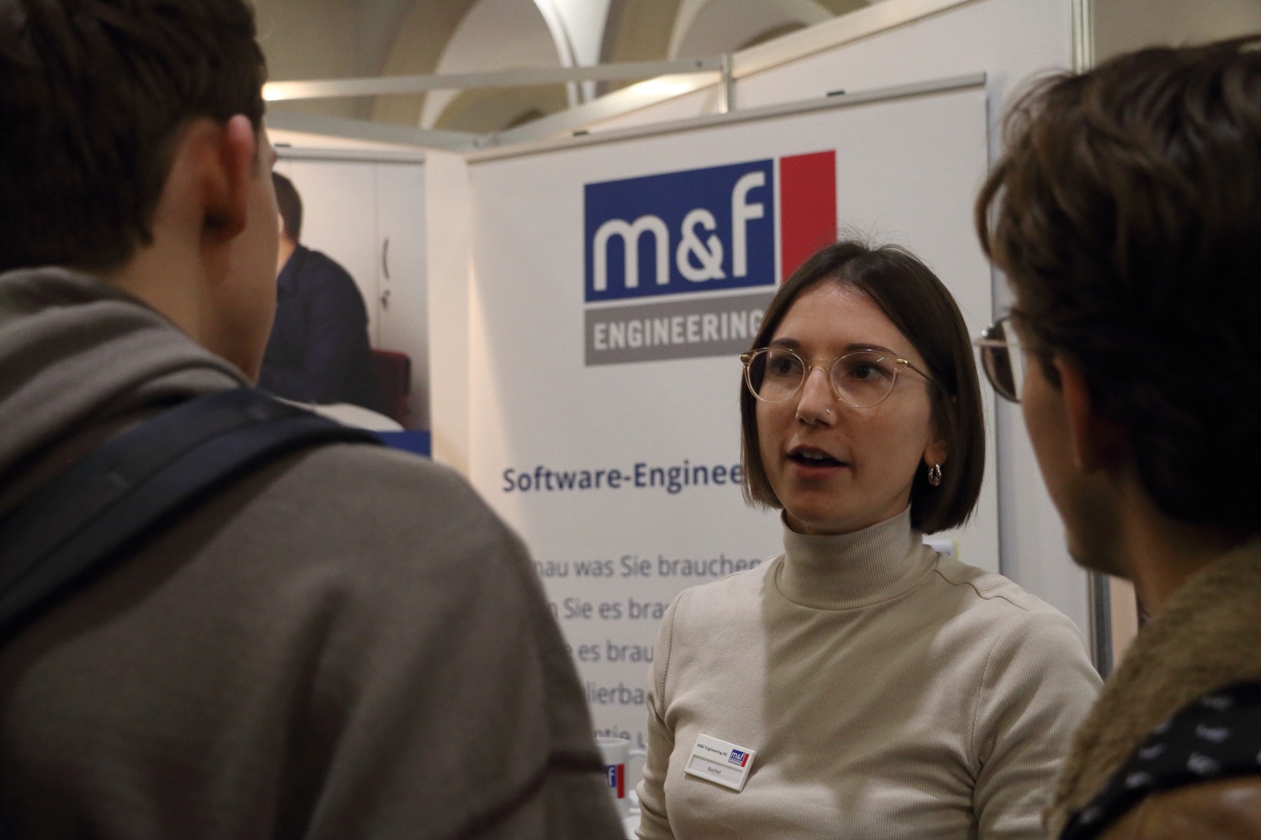 A student in conversation at the M&F booth