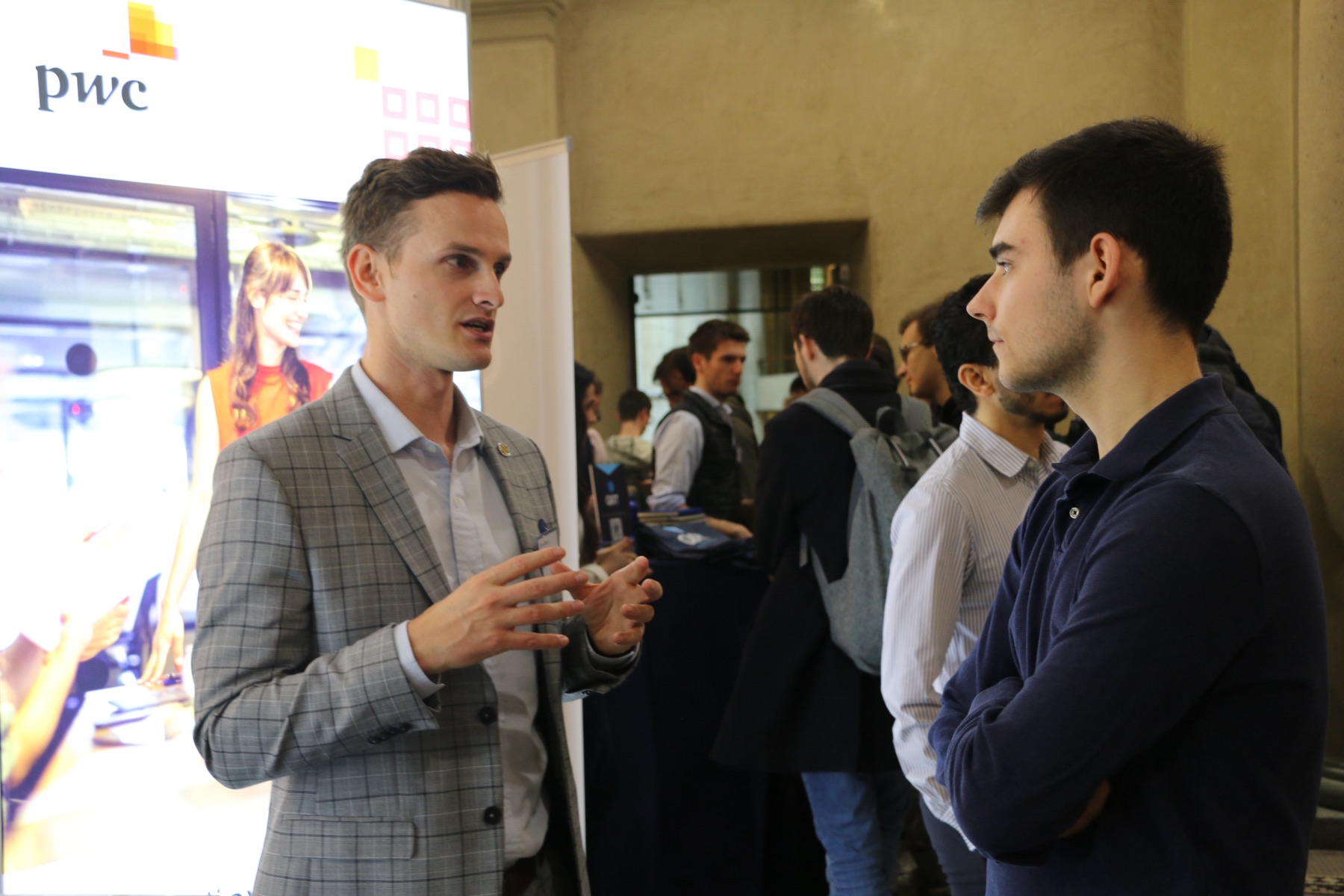 A conversation at the PwC booth